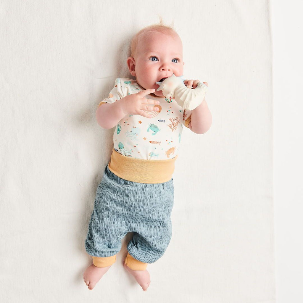 Organic shortsleeve baby body "Ocean Party" made from 95% organic cotton and 5% elastane